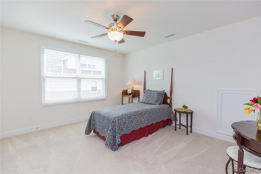 1372 Miners Trail Road Midlothian, VA 23114 - Photo 34 of 50 a bedroom with a bed and a chandelier