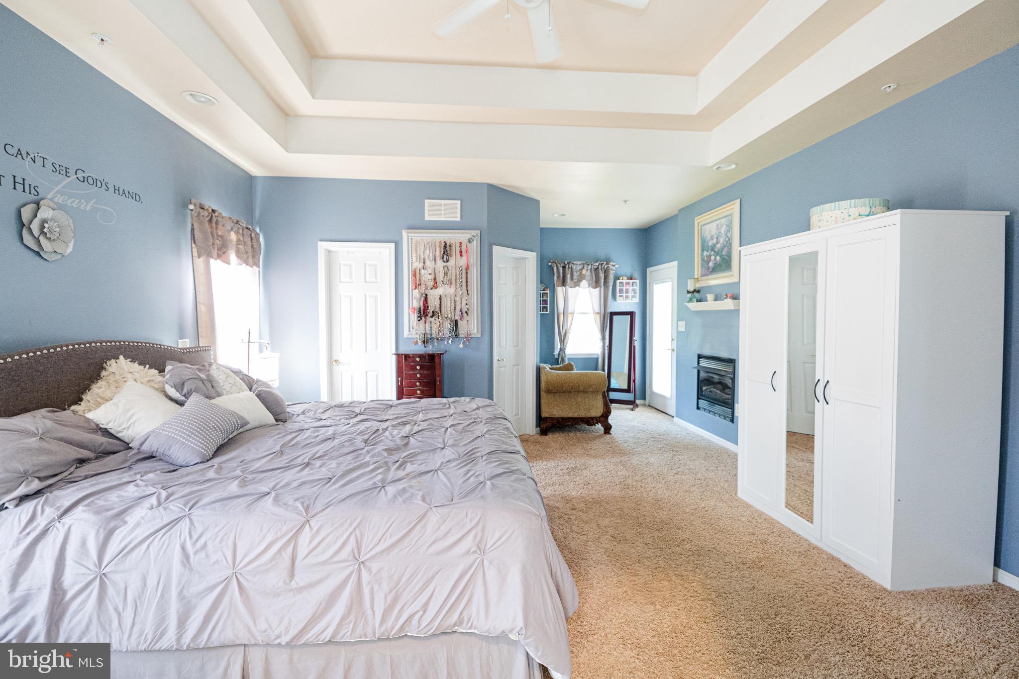 2561 Cedar Ridge Drive Westminster, MD 21158 - Photo 11 of 38 a spacious bedroom with a bed and a refrigerator