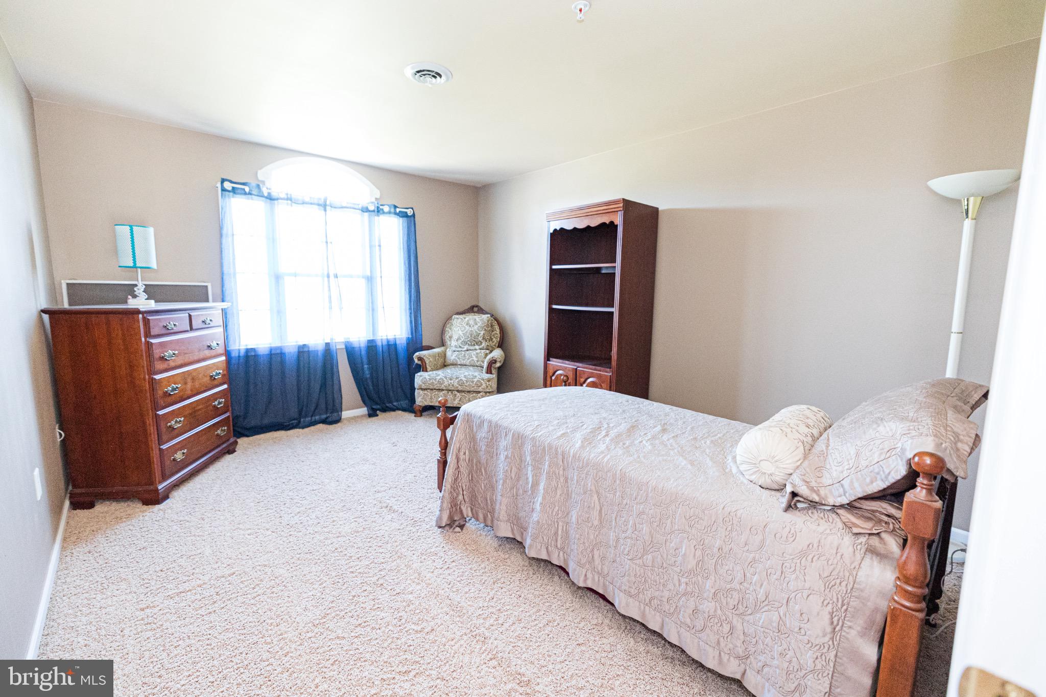 2561 Cedar Ridge Drive Westminster, MD 21158 - Photo 14 of 38 a bedroom with a bed and a dresser