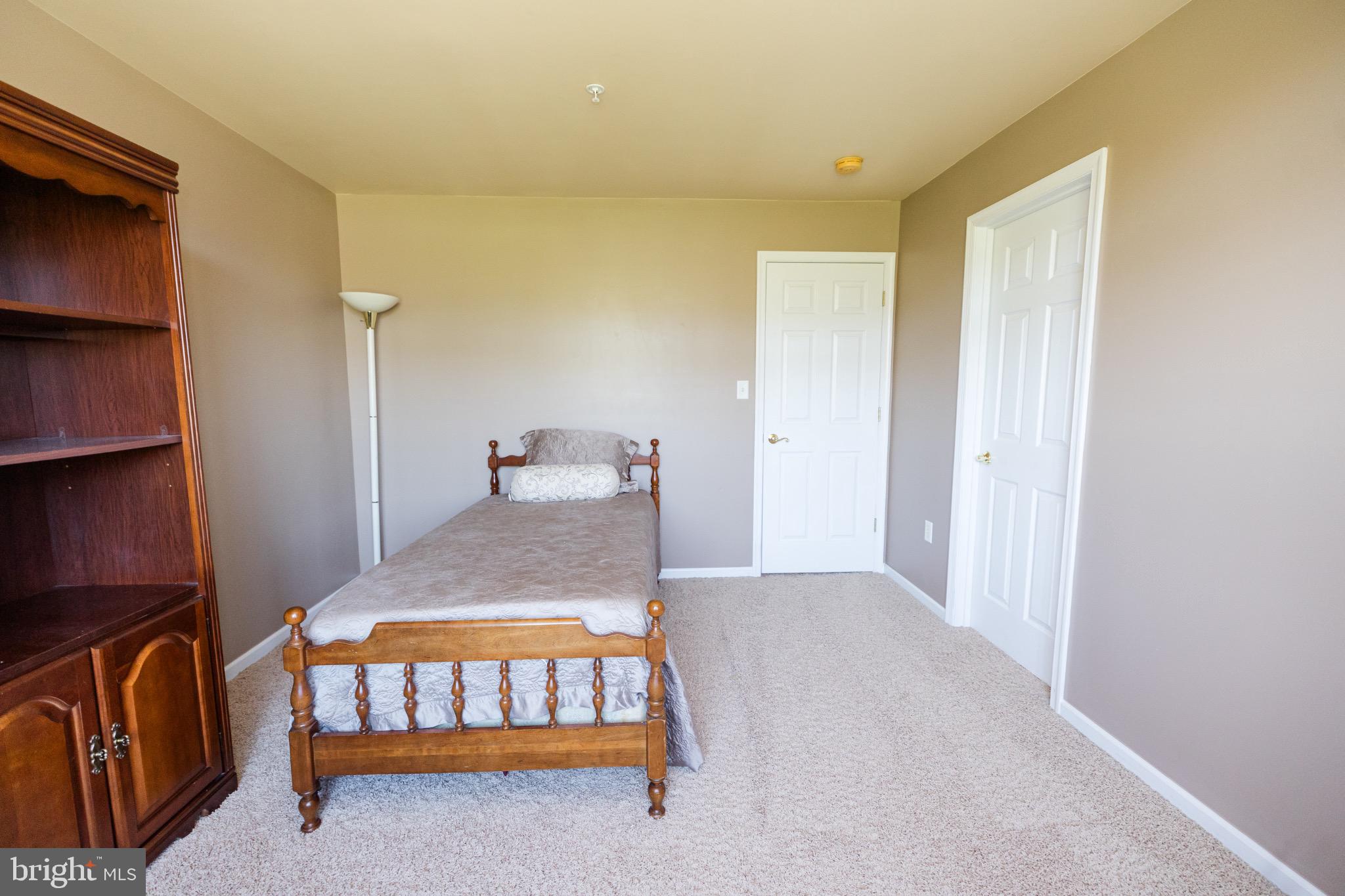 2561 Cedar Ridge Drive Westminster, MD 21158 - Photo 16 of 38 a bedroom with furniture and a window