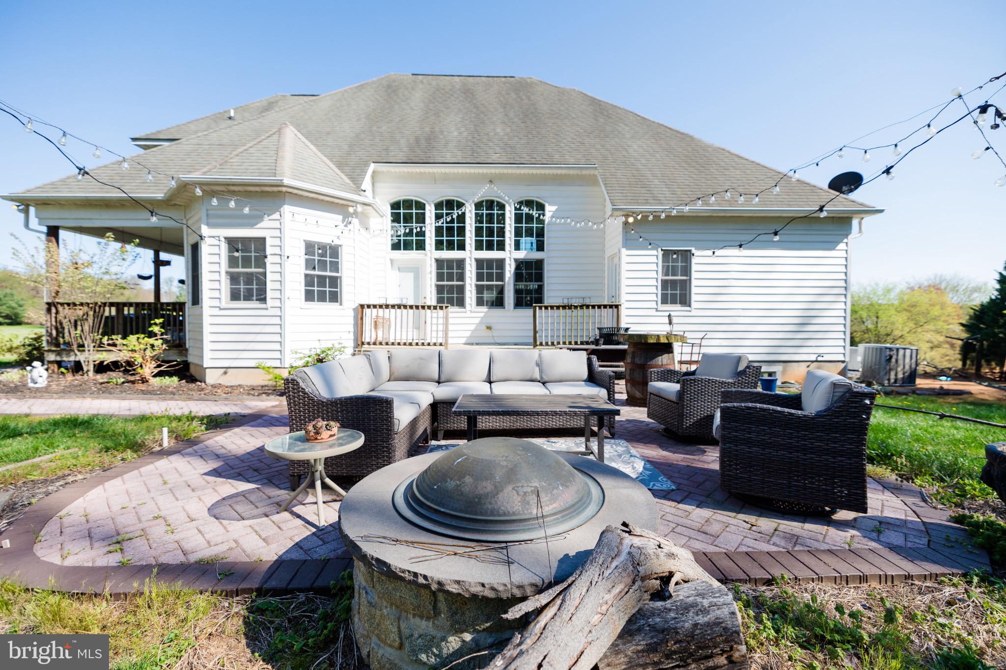 2561 Cedar Ridge Drive Westminster, MD 21158 - Photo 25 of 38 a living room with furniture and a fireplace