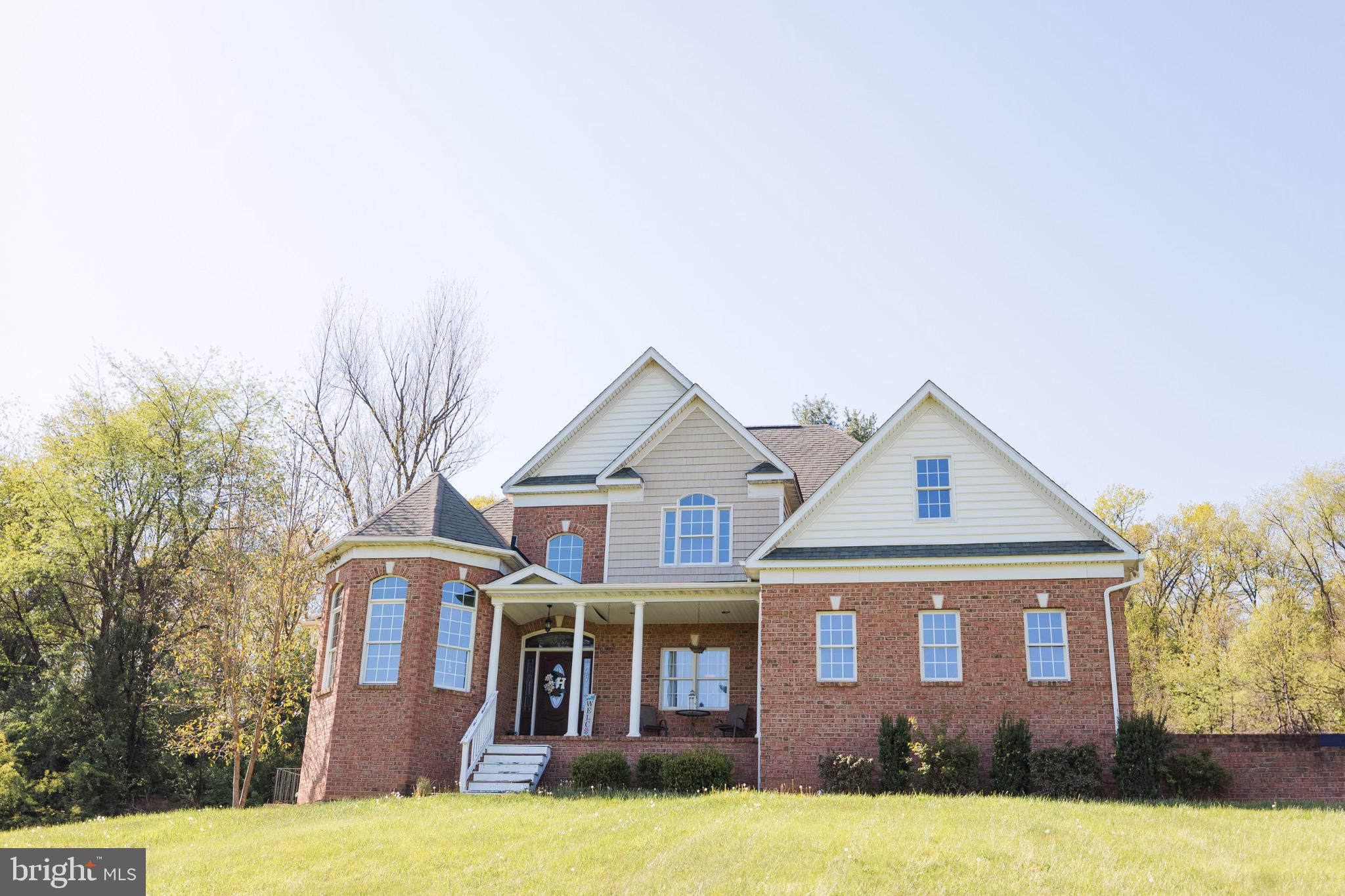 2561 Cedar Ridge Drive Westminster, MD 21158 - Photo 29 of 38 a front view of a house with yard and garage