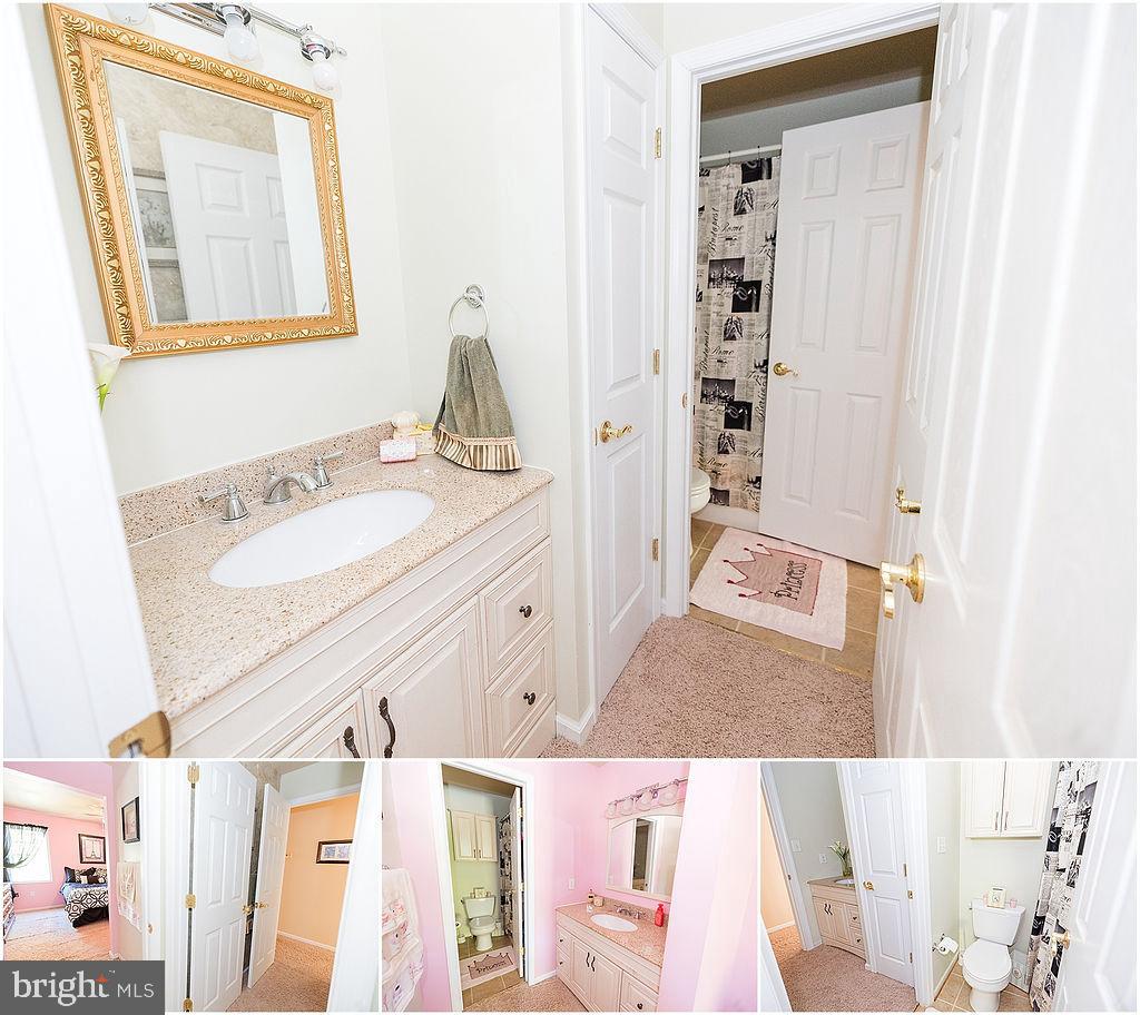 2561 Cedar Ridge Drive Westminster, MD 21158 - Photo 35 of 38 a bathroom with a sink vanity granite tub shower and a mirror