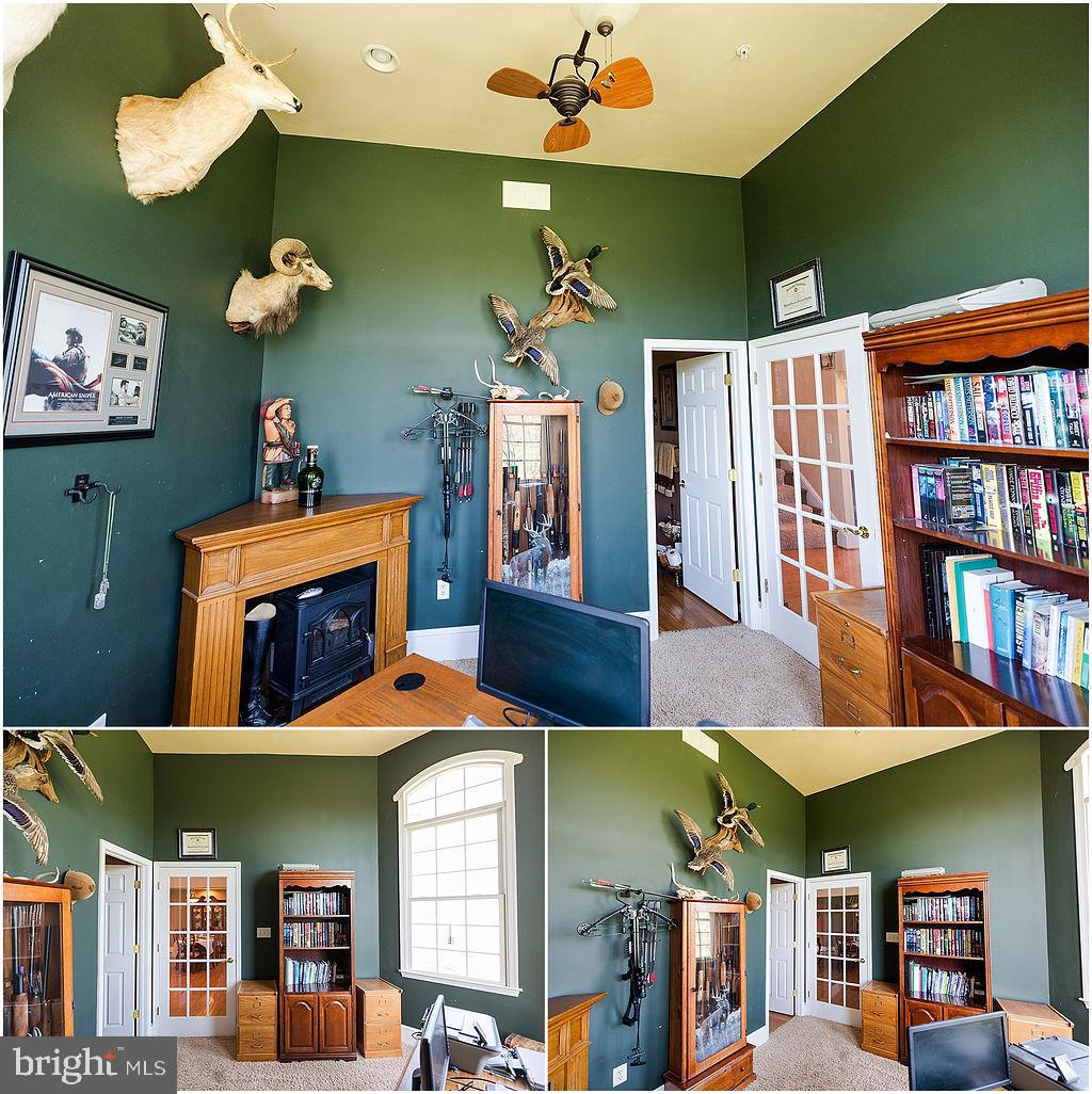2561 Cedar Ridge Drive Westminster, MD 21158 - Photo 38 of 38 a front view of a house with lots of shelves and a chandelier