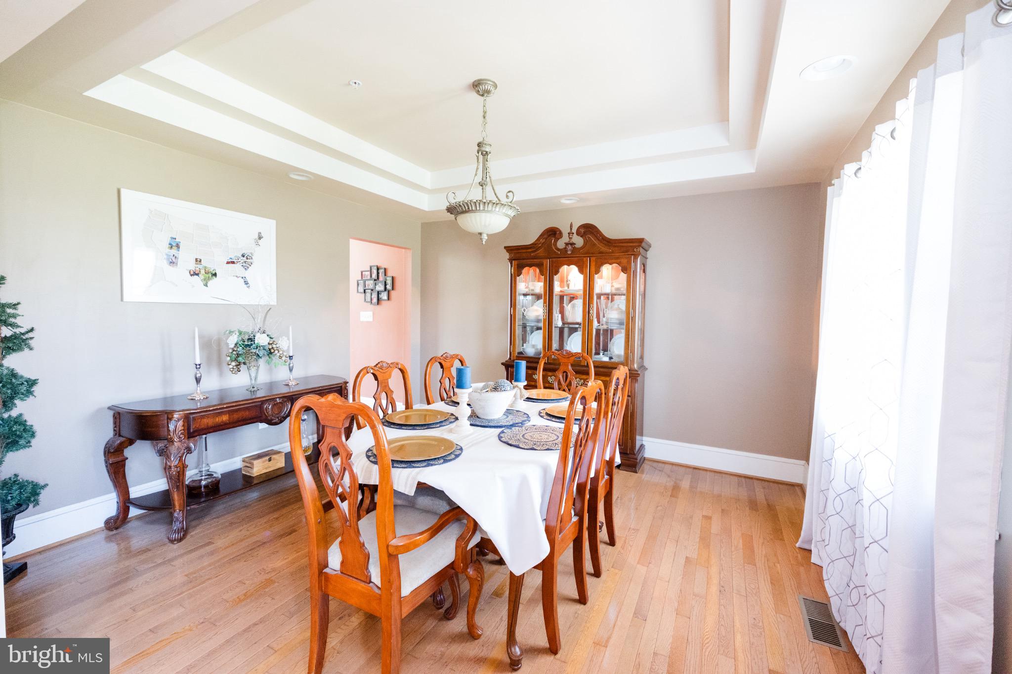 2561 Cedar Ridge Drive Westminster, MD 21158 - Photo 9 of 38 a view of a dining room with furniture and wooden floor