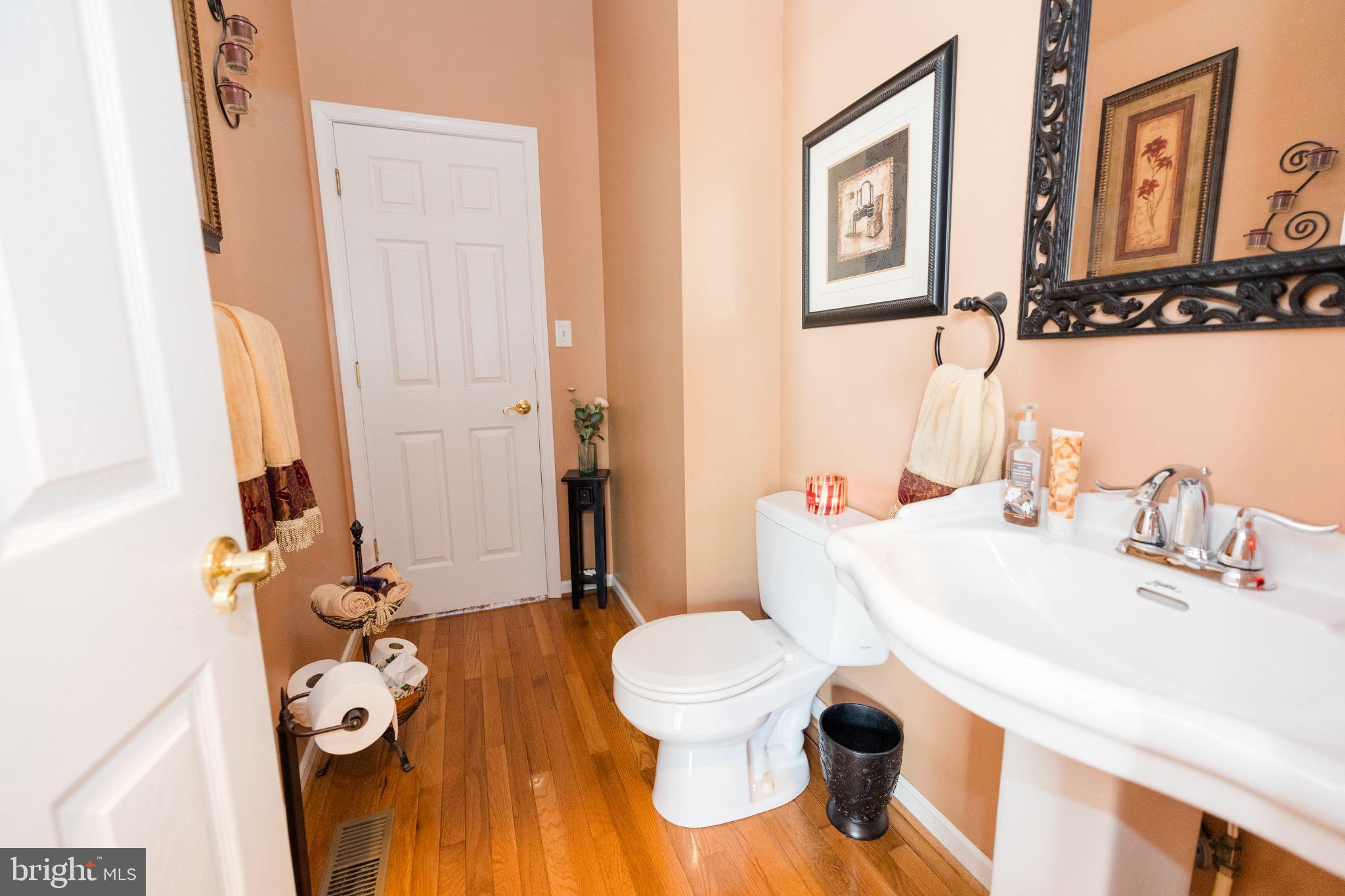 2561 Cedar Ridge Drive Westminster, MD 21158 - Photo 10 of 38 a bathroom with a sink and a mirror