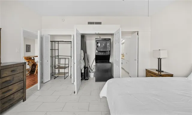 a bedroom with a bed and a cabinets