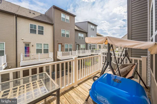 a view of a brick building with floor to ceiling windows