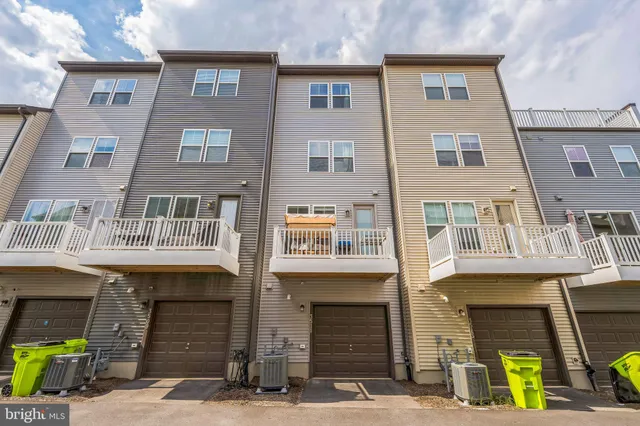 a front view of a building with many windows