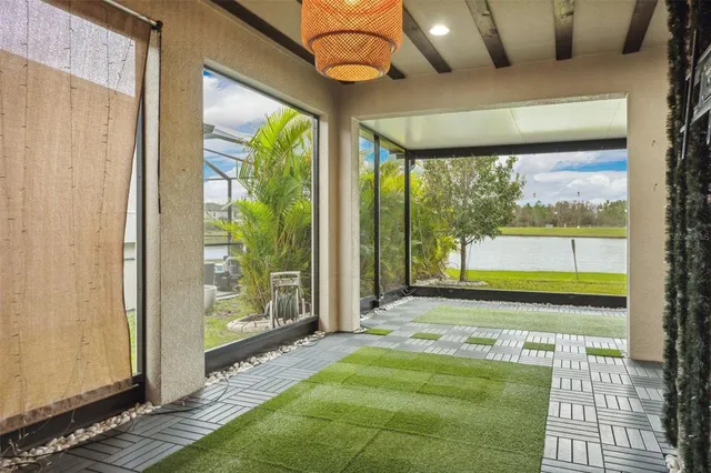 a room with a large window and a bed