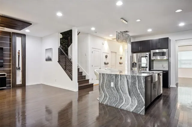 a view of kitchen with furniture and wooden floor