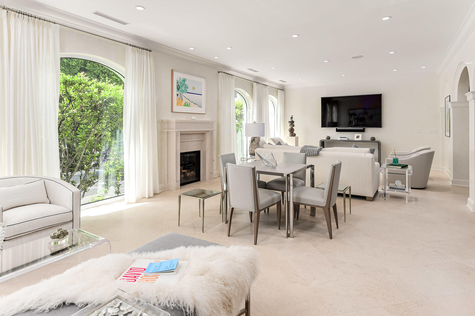 130 Cocoanut Row Palm Beach, FL 33480 - Photo 14 of 31 a living room with furniture a flat screen tv and a fireplace