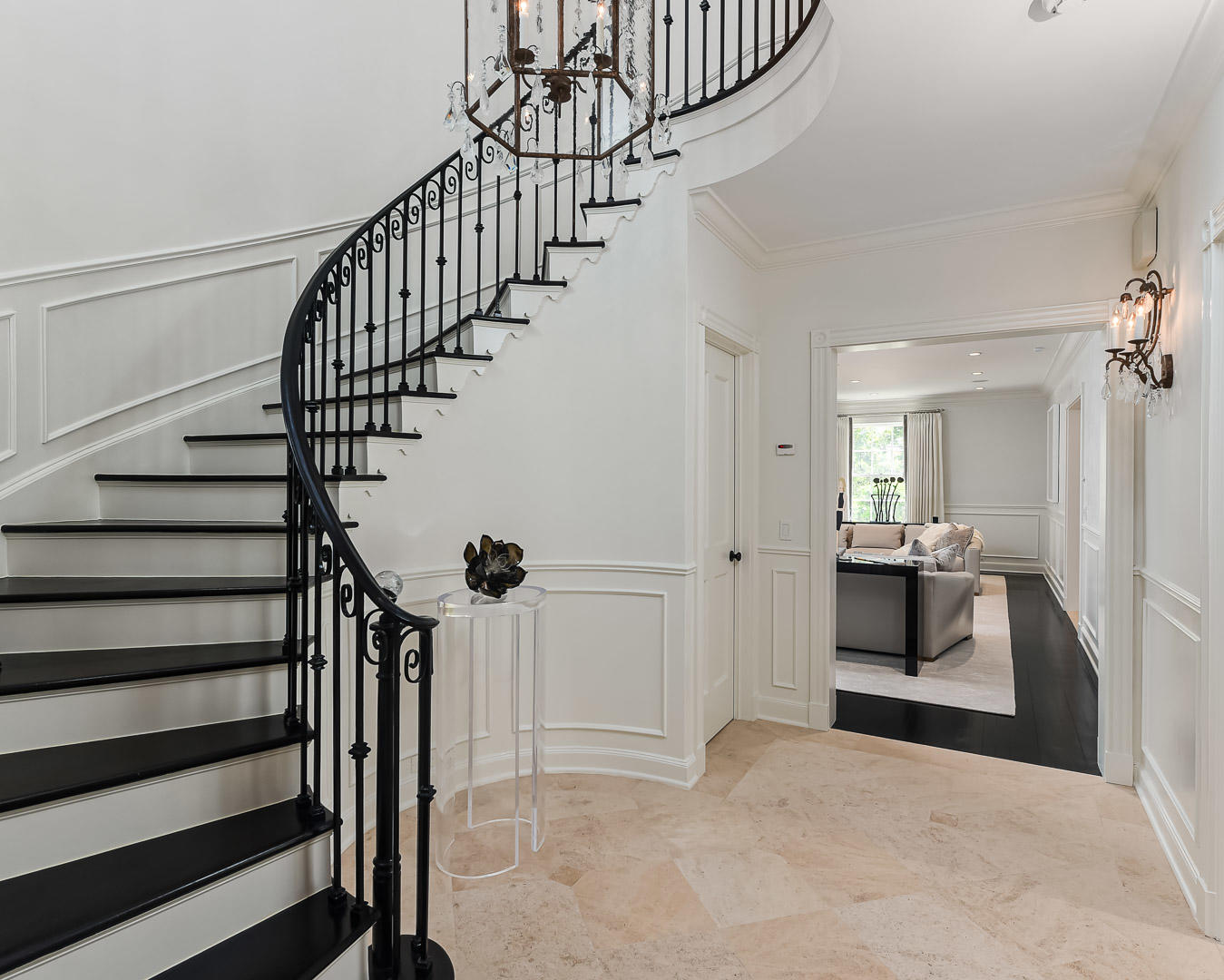 130 Cocoanut Row Palm Beach, FL 33480 - Photo 19 of 31 a view of a hallway to a livingroom with wooden floor and staircase