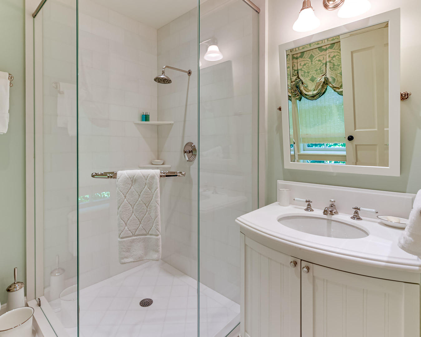 130 Cocoanut Row Palm Beach, FL 33480 - Photo 27 of 31 a bathroom with a shower sink and mirror