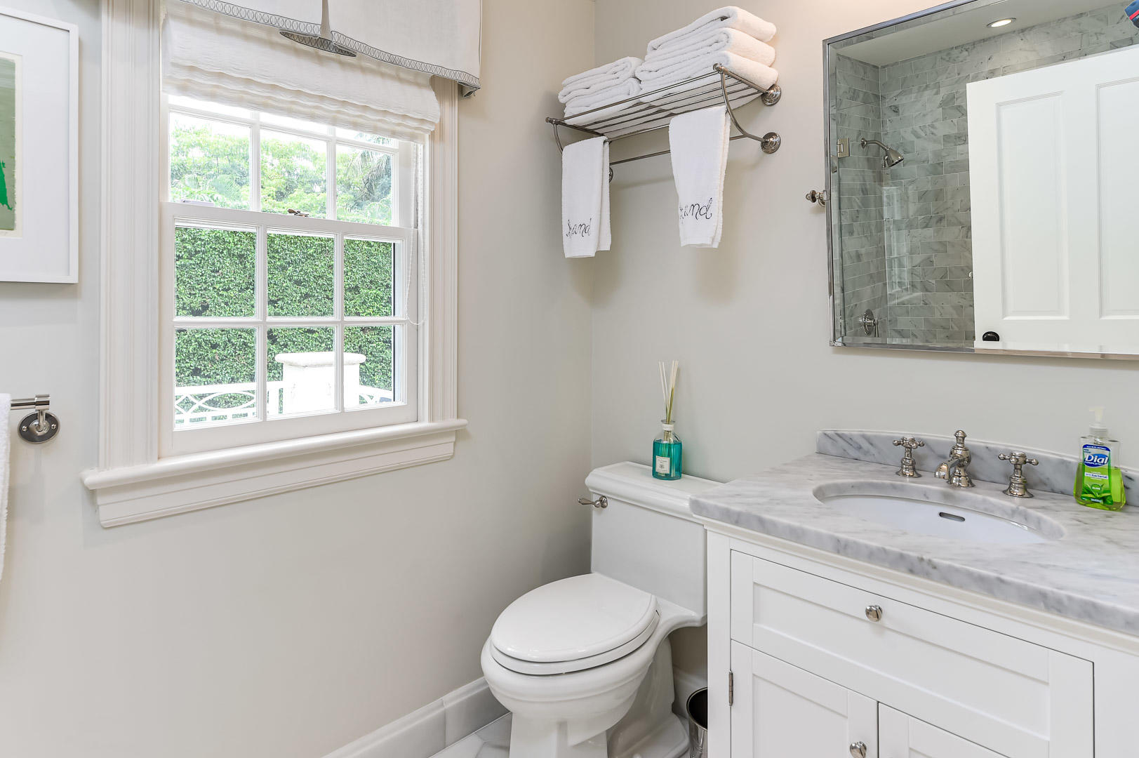 130 Cocoanut Row Palm Beach, FL 33480 - Photo 29 of 31 a bathroom with a granite countertop toilet a sink a mirror and a window