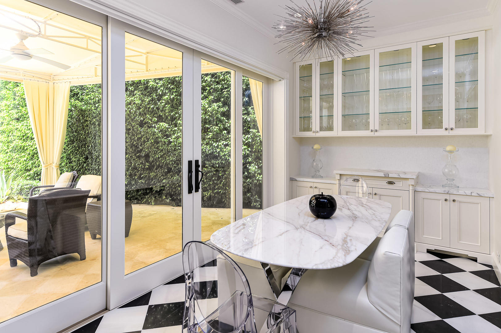 130 Cocoanut Row Palm Beach, FL 33480 - Photo 9 of 31 a view of a dining room with a table and chairs
