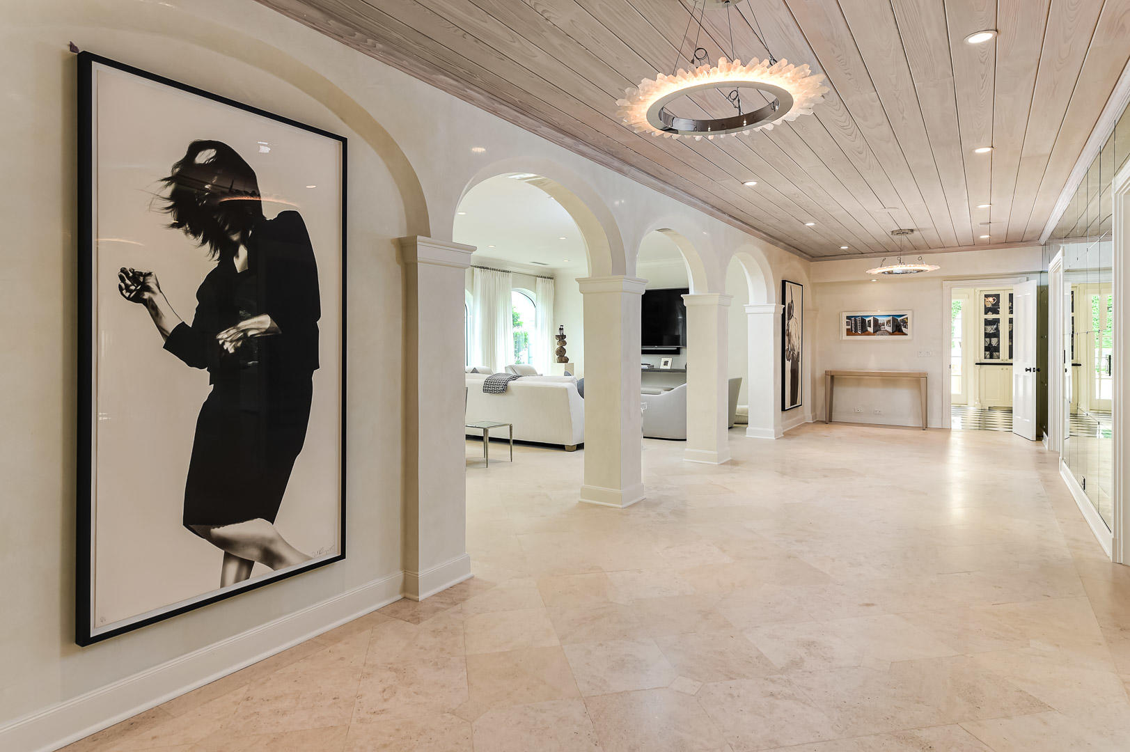 130 Cocoanut Row Palm Beach, FL 33480 - Photo 10 of 31 a view of a hallway with dining room and mirror