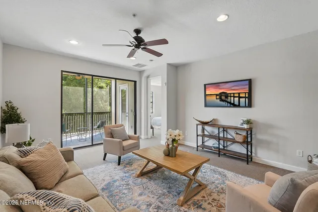 a bedroom with a bed lamp and window