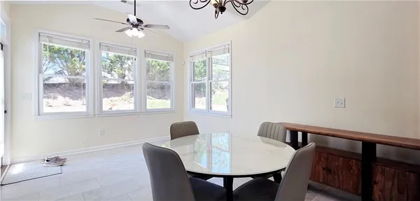 a view of a dining room with furniture window and outside view
