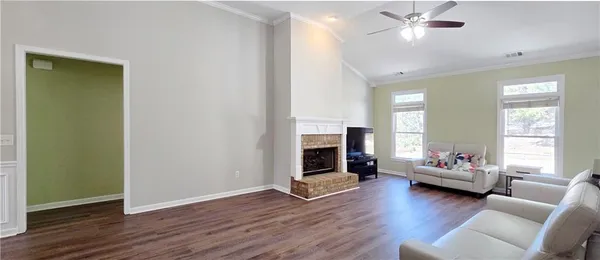 a living room with furniture and a fireplace