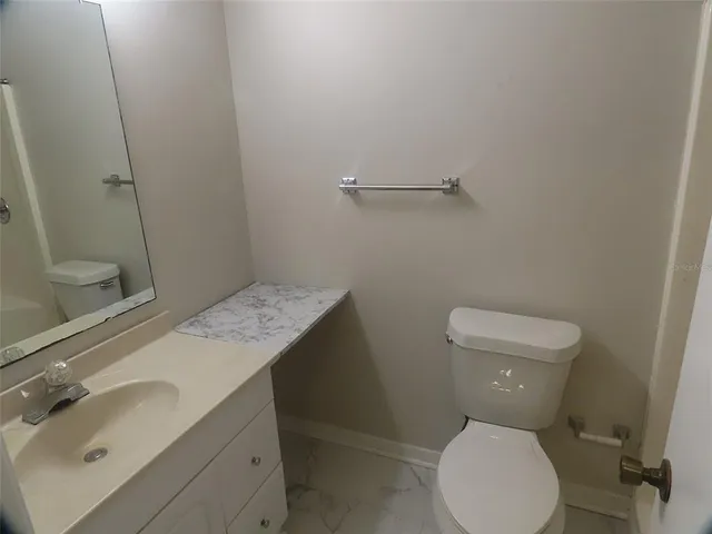 a bathroom with a sink and toilet
