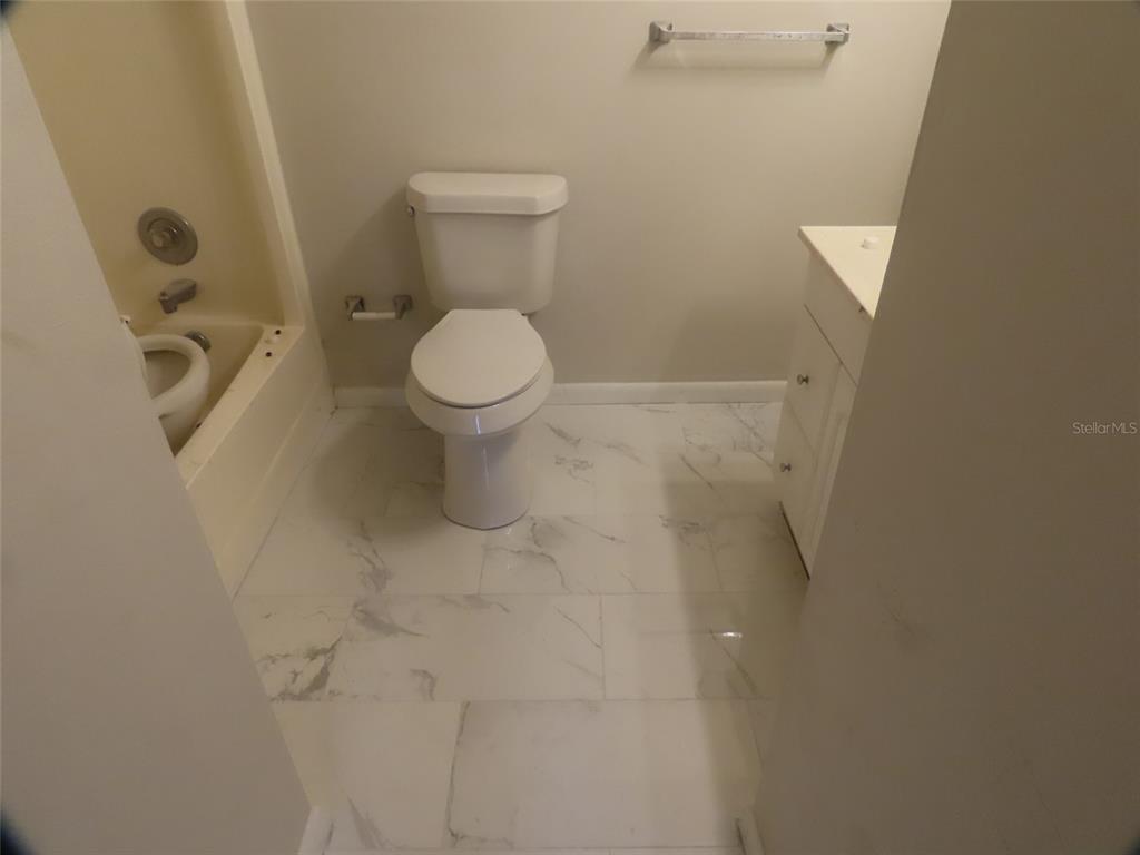 708 St Michael Lane Altamonte Springs, FL 32714 - Photo 13 of 26 a bathroom with a toilet and a shower