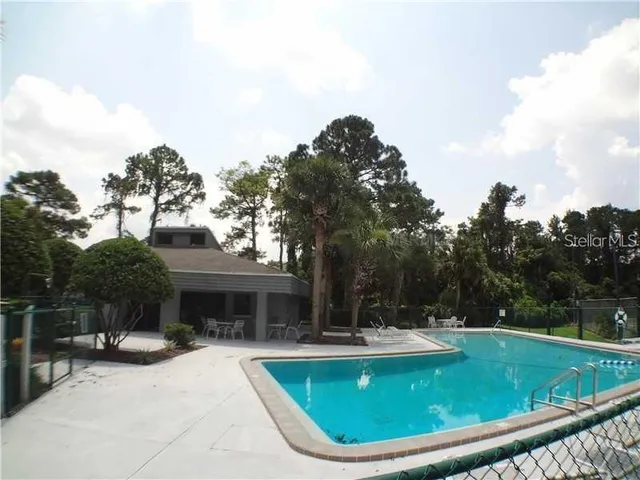 a view of a swimming pool with a patio