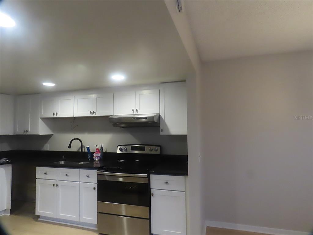 708 St Michael Lane Altamonte Springs, FL 32714 - Photo 6 of 26 a kitchen with a sink and cabinets