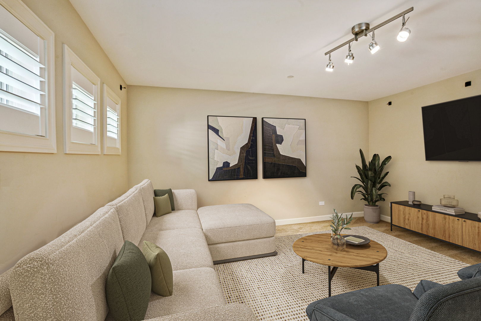 92 Legacy Lane Wheeling, IL 60090 - Photo 18 of 28 a living room with furniture and a flat screen tv