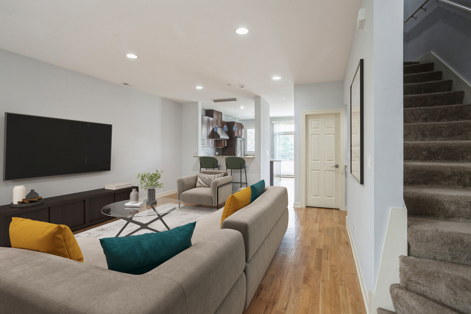 92 Legacy Lane Wheeling, IL 60090 - Photo 4 of 28 a living room with furniture and a flat screen tv