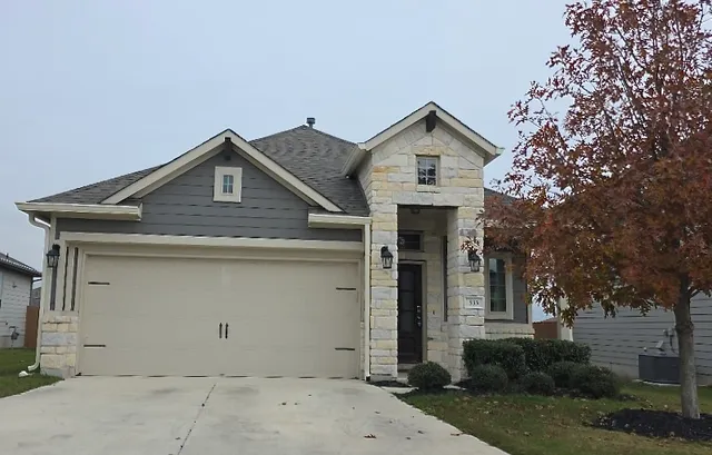 a view of house with garage