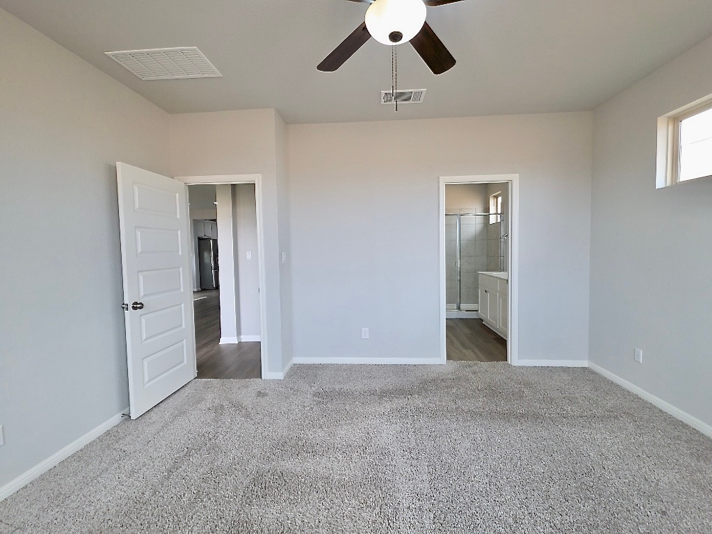 533 Rearing Mare Pass Georgetown, TX 78626 - Photo 12 of 22 a view of an empty room and chandelier fan