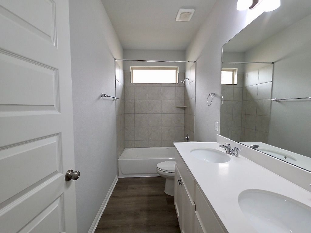 533 Rearing Mare Pass Georgetown, TX 78626 - Photo 17 of 22 a bathroom with a sink a toilet and shower