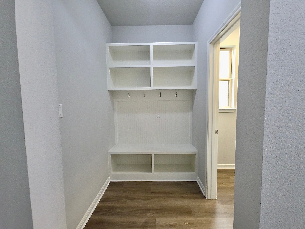 533 Rearing Mare Pass Georgetown, TX 78626 - Photo 4 of 22 a view of an empty room with wooden floor and entryway