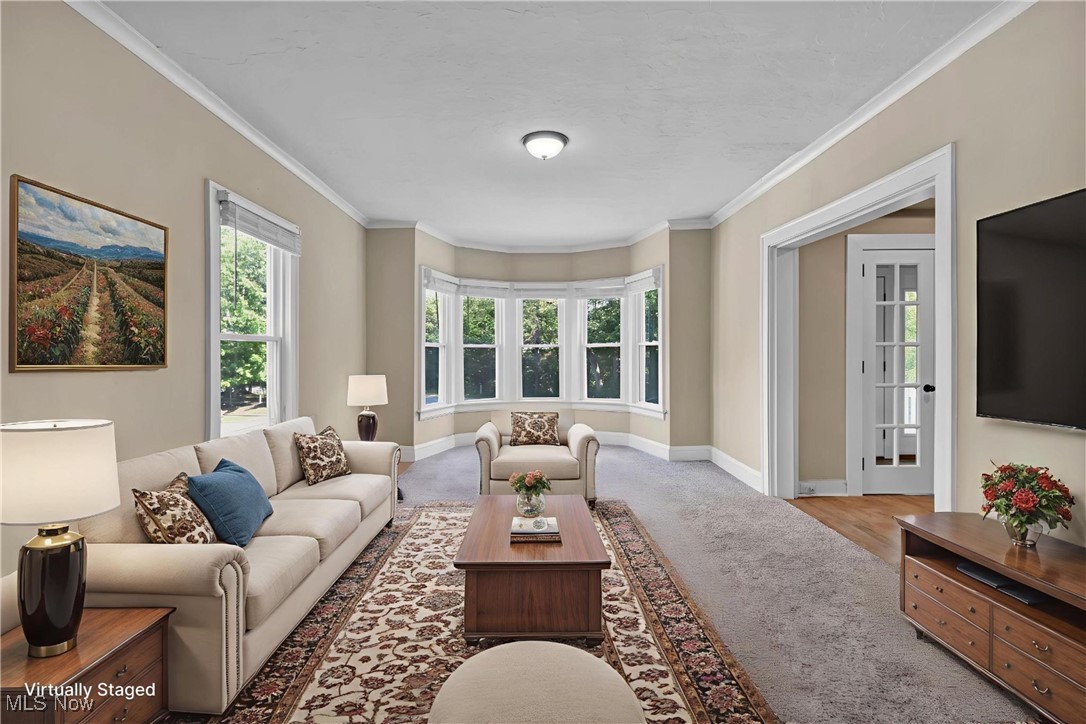 3312 Redwood Road Cleveland Heights, OH 44118 - Photo 13 of 28 Living area with crown molding and carpet flooring