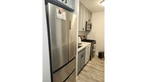 a kitchen with a sink and cabinets