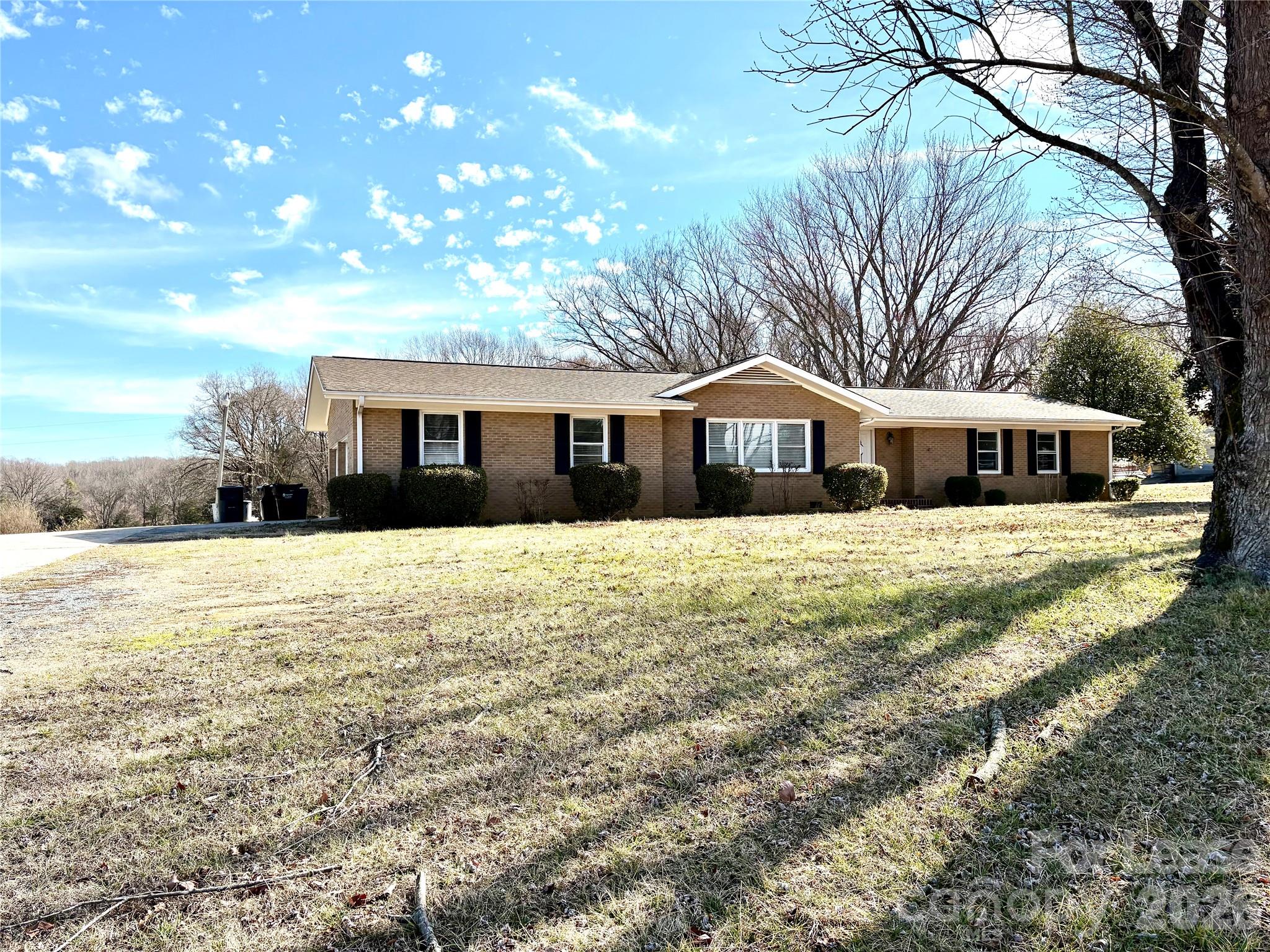 2801 Potter Road Waxhaw, NC 28173 - Photo 1 of 4 a front view of house with yard and trees around