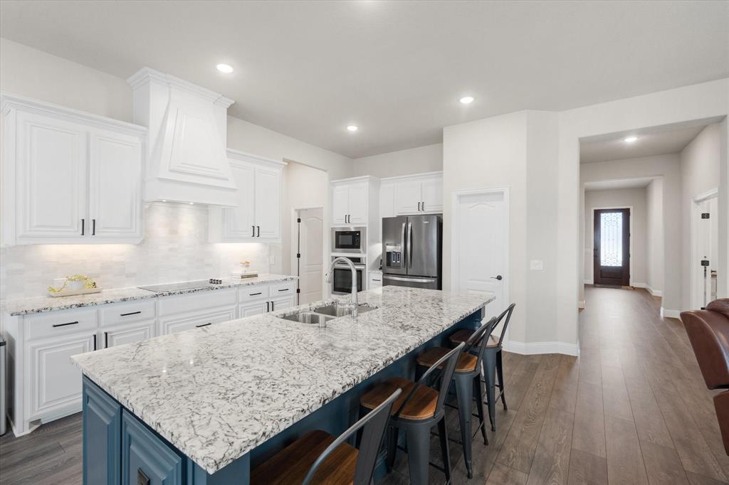 5626 Rowlan Row Midlothian, TX 76065 - Photo 1 of 39 Custom kitchen with large panel wrapped island.