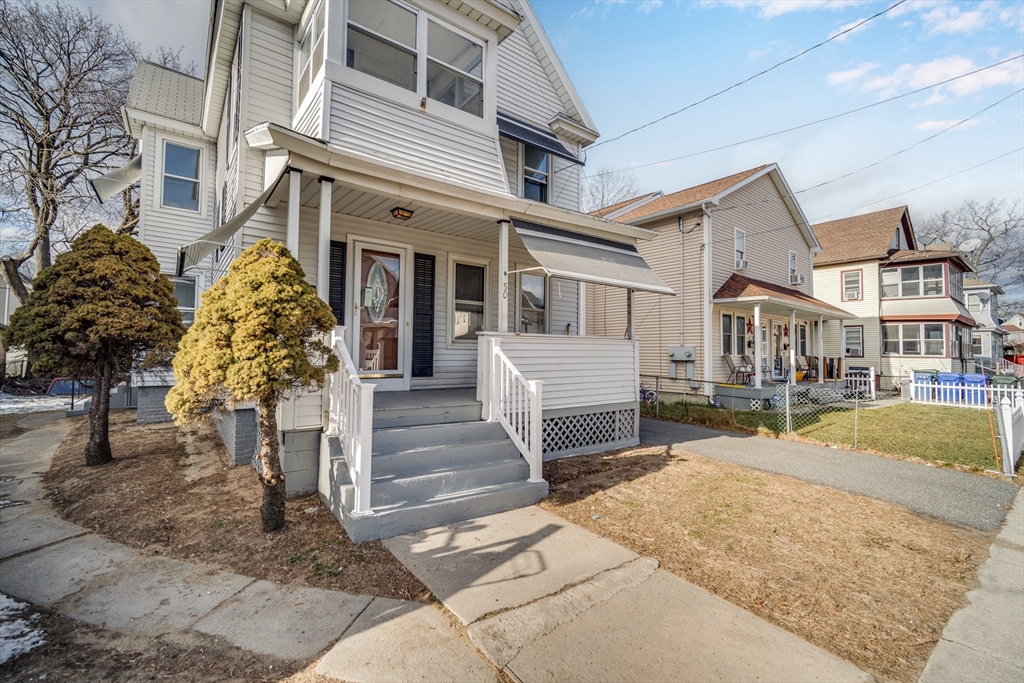50 Home Street Springfield, MA 01104 - Photo 1 of 18 front view of a house with a yard