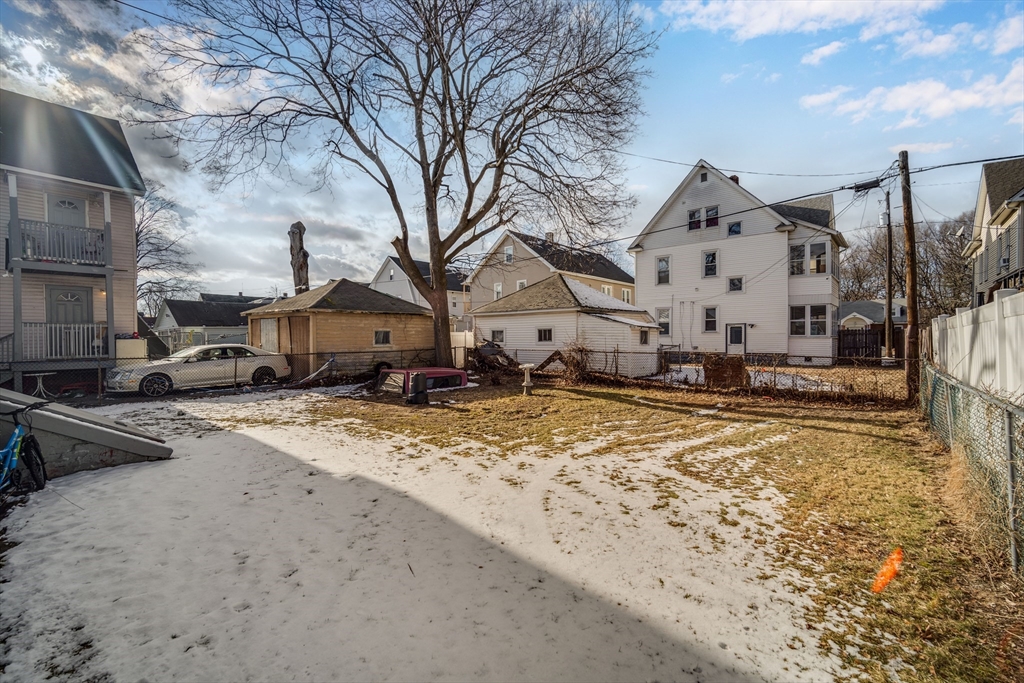 50 Home Street Springfield, MA 01104 - Photo 2 of 18 a view of a house with snow on the road