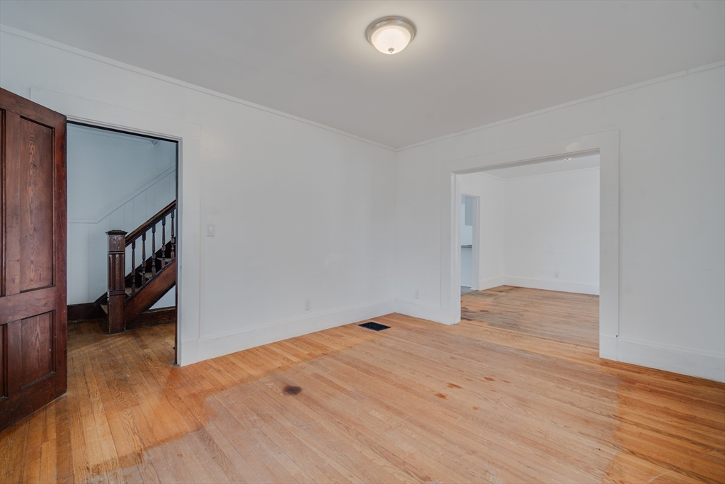 50 Home Street Springfield, MA 01104 - Photo 5 of 18 a view of empty room with wooden floor
