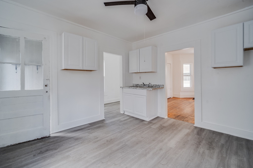 50 Home Street Springfield, MA 01104 - Photo 9 of 18 a view of cabinets and wooden floor