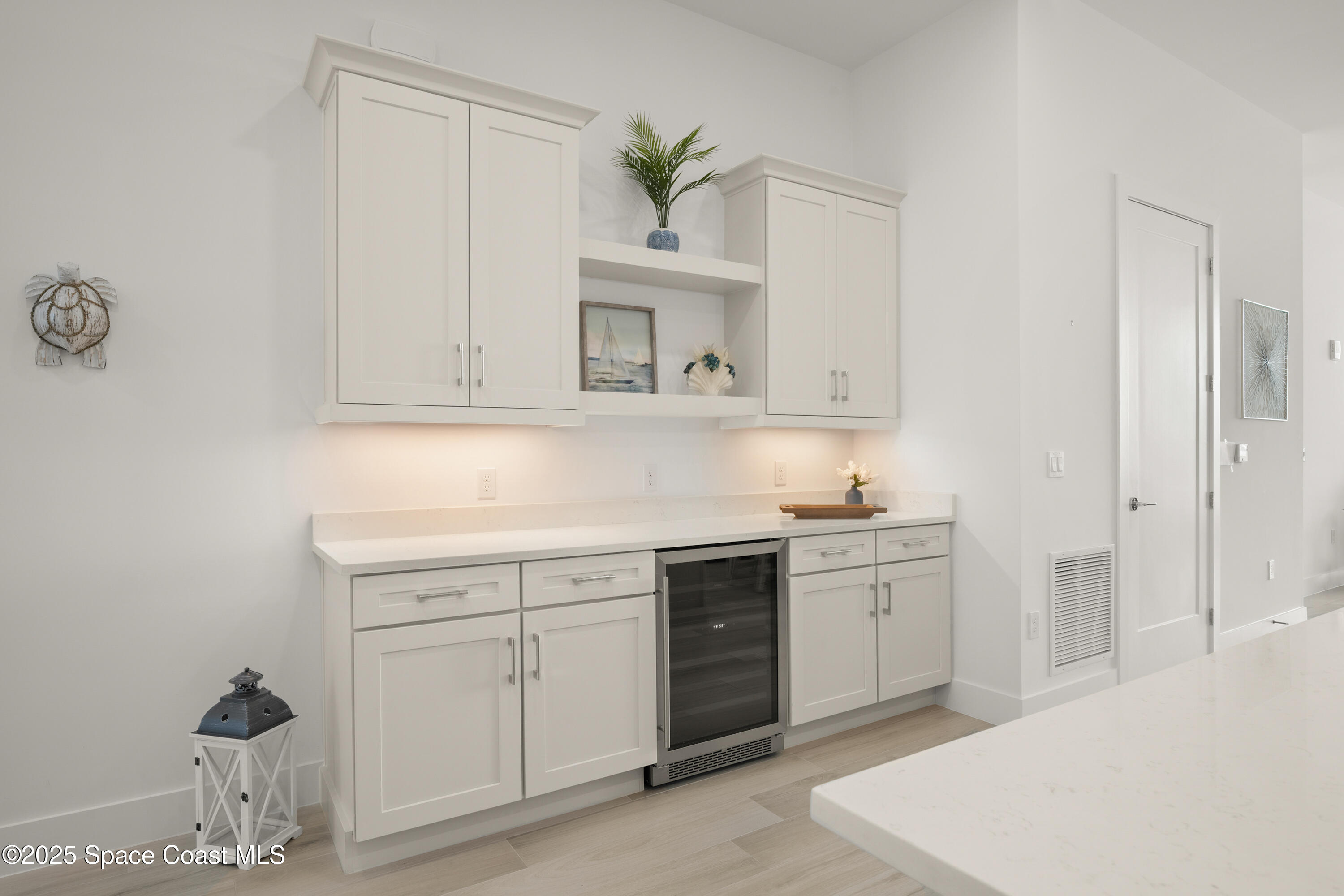 225 Strand Drive, Unit 406 Melbourne Beach, FL 32951 - Photo 29 of 49 a kitchen with a sink cabinets and window