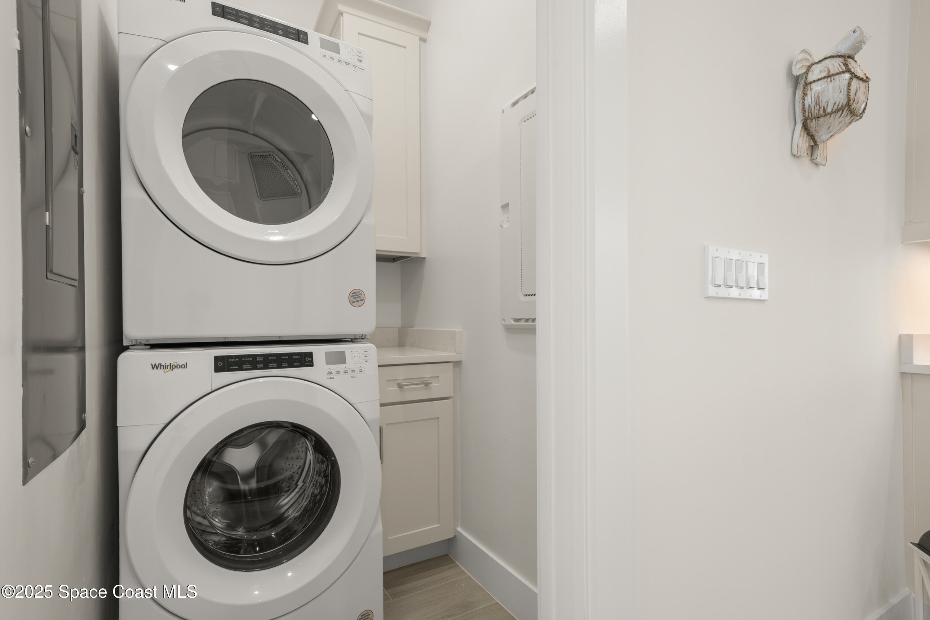 225 Strand Drive, Unit 406 Melbourne Beach, FL 32951 - Photo 33 of 49 a utility room with dryer and washer