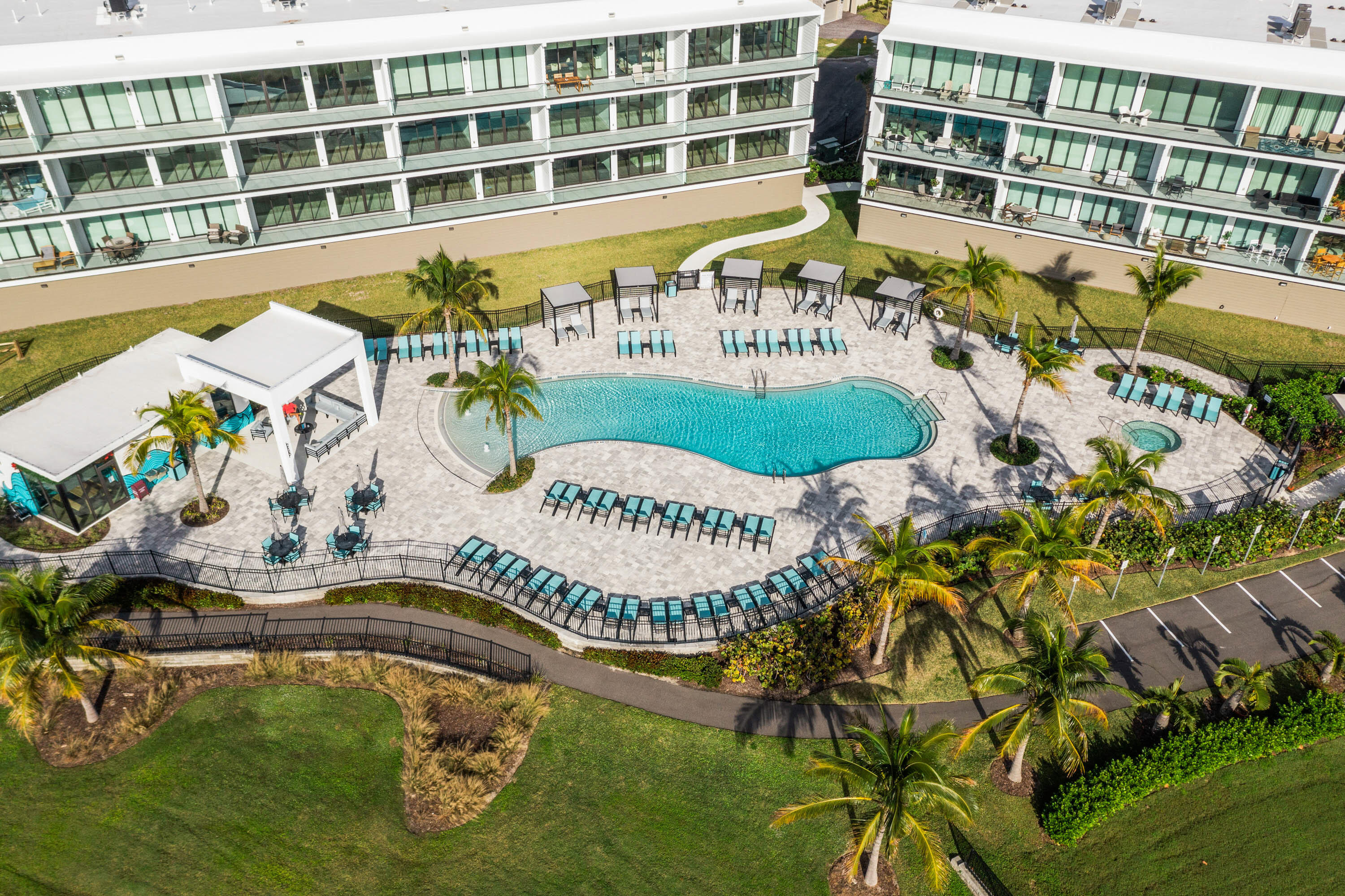 225 Strand Drive, Unit 406 Melbourne Beach, FL 32951 - Photo 4 of 49 an aerial view of a swimming pool and outdoor space