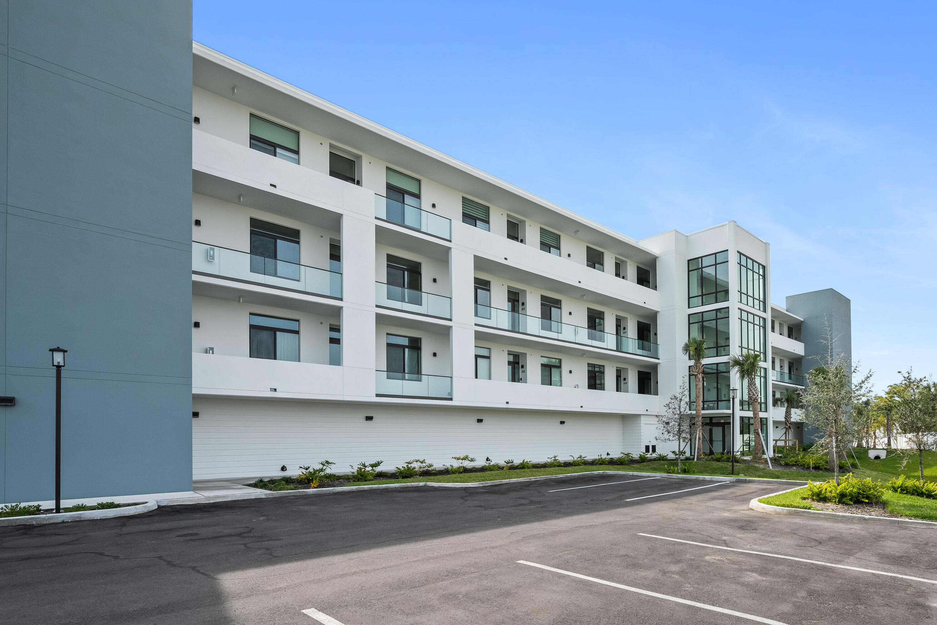 225 Strand Drive, Unit 406 Melbourne Beach, FL 32951 - Photo 9 of 49 a front view of a building with street