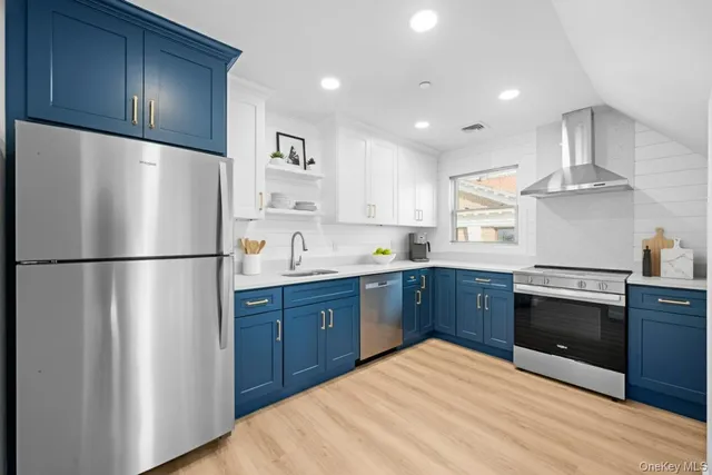 a kitchen with stainless steel appliances granite countertop a refrigerator stove a sink dishwasher and a refrigerator with wooden cabinets