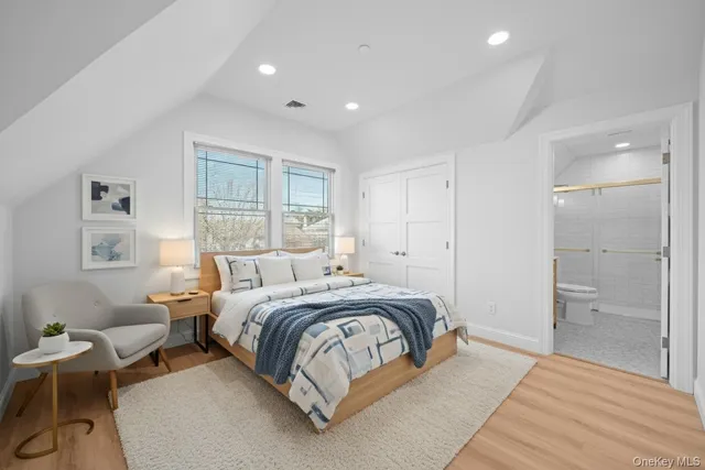 a bedroom with a bed and a table