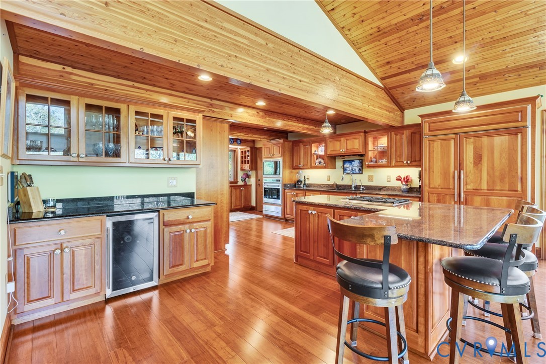 176 Baypointe Court Reedville, VA 22539 - Photo 28 of 60 a kitchen with stainless steel appliances granite countertop a stove and cabinets