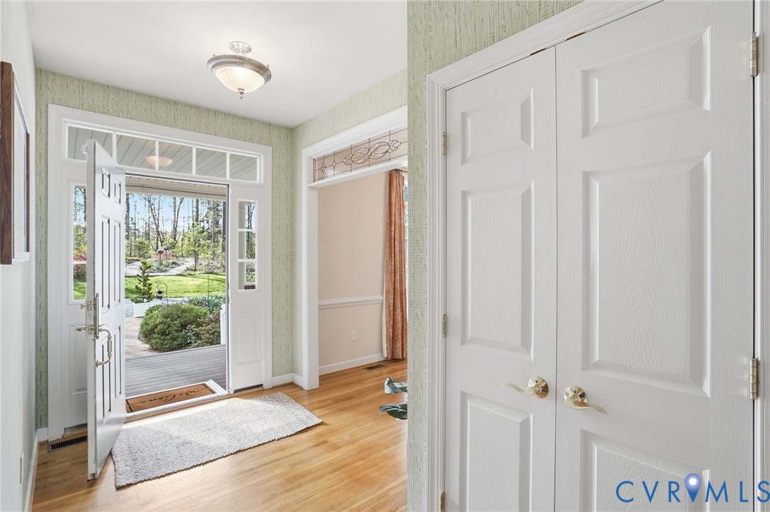 14430 Overlook Ridge Lane Beaverdam, VA 23015 - Photo 16 of 71 a view of a hallway with wooden floor and doors